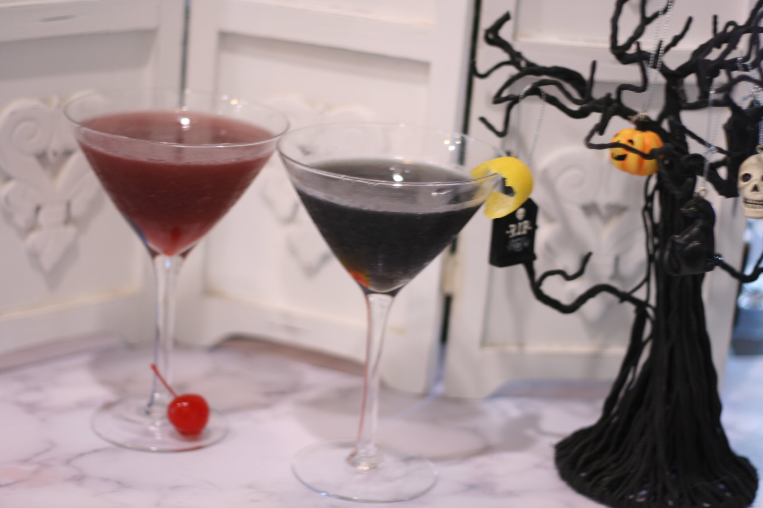 The Black Martini using just clear vodka in the glass on the left and black colored vodka in the glass on the right