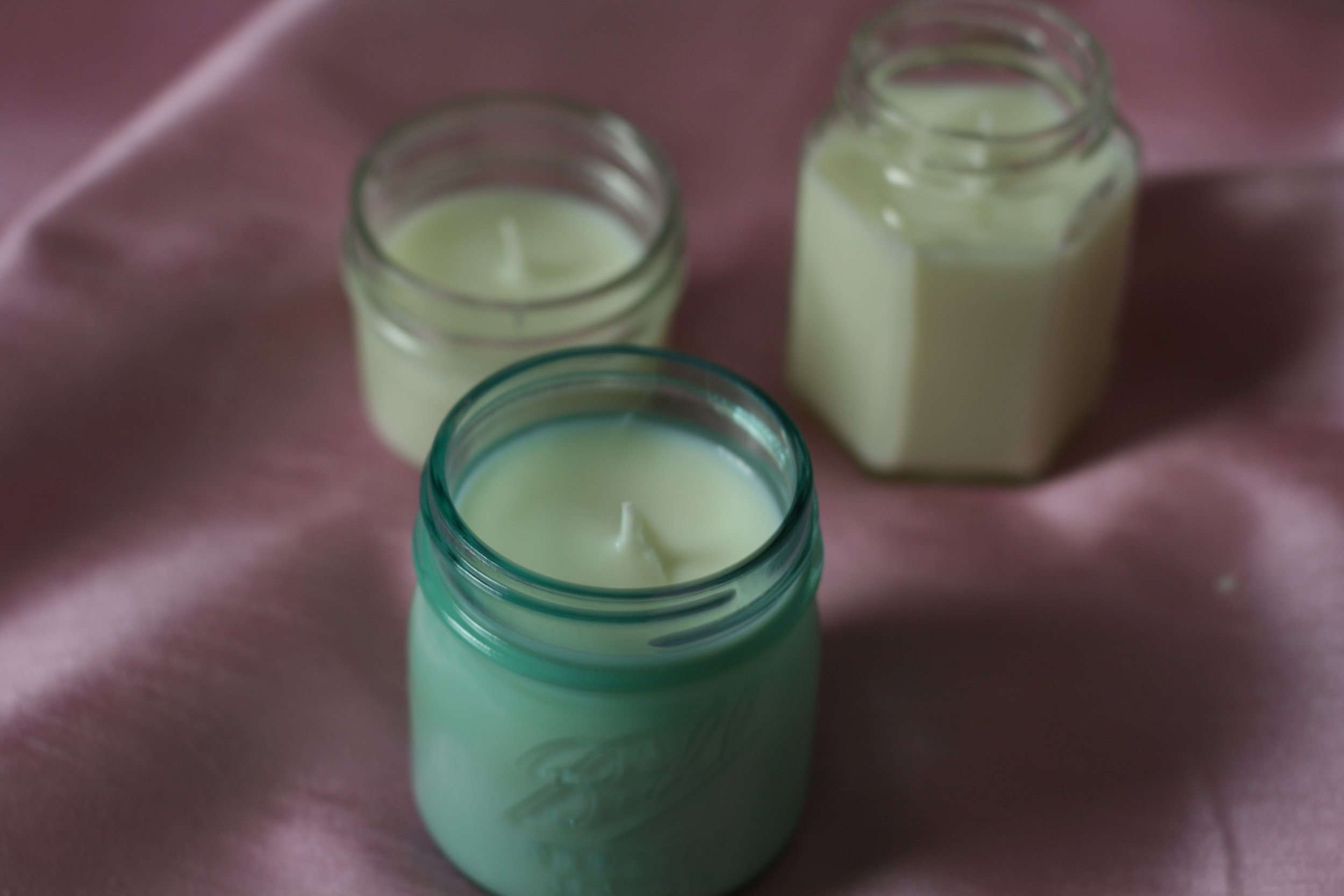 3 homemade soy candles in jars